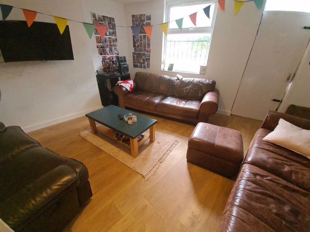 Property photo 2 of 18 A Welcoming Living Room Featuring Comfortable Sofa...
