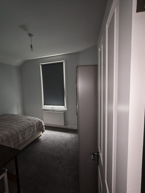 Property photo 2 of 5 Sleek Bedroom With Modern Decor And Ample Space...