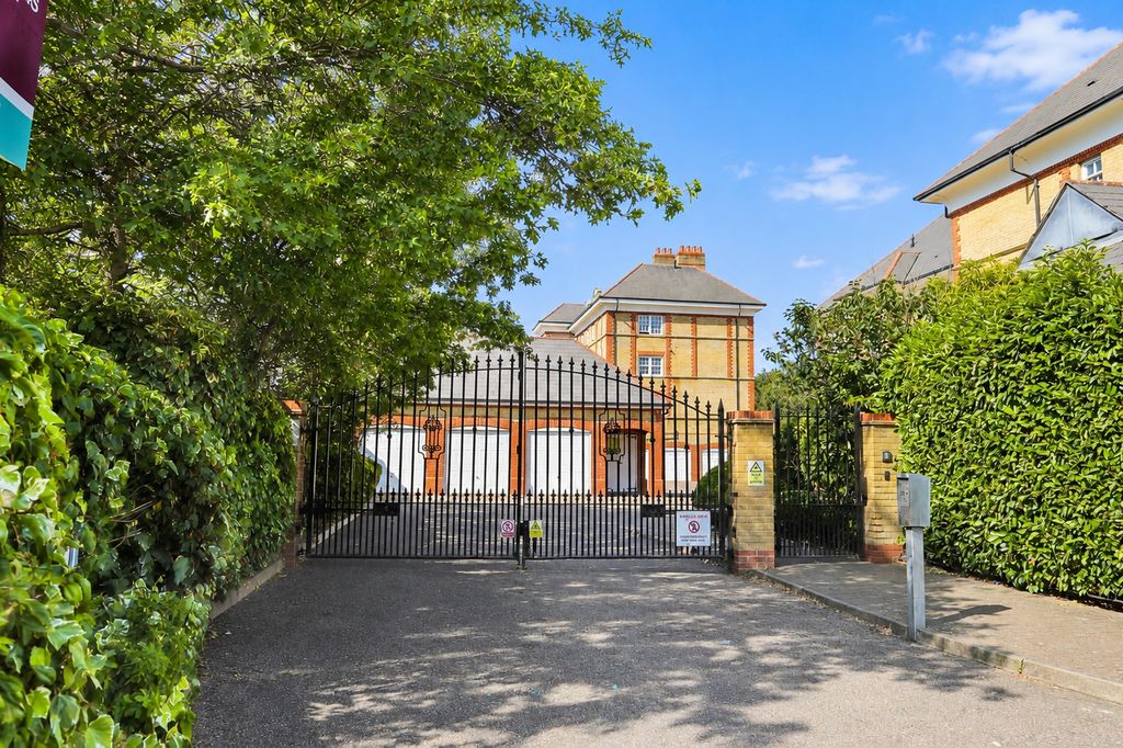 Property photo 1 of 8 A_Bright_Sunny_Outdoor_Scene_Showing_A_Gated_Resi