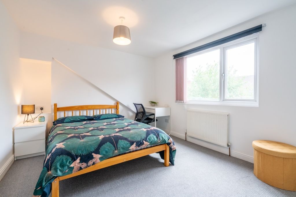 Property photo 3 of 10 Bright And Welcoming Bedroom Featuring A Double Be...