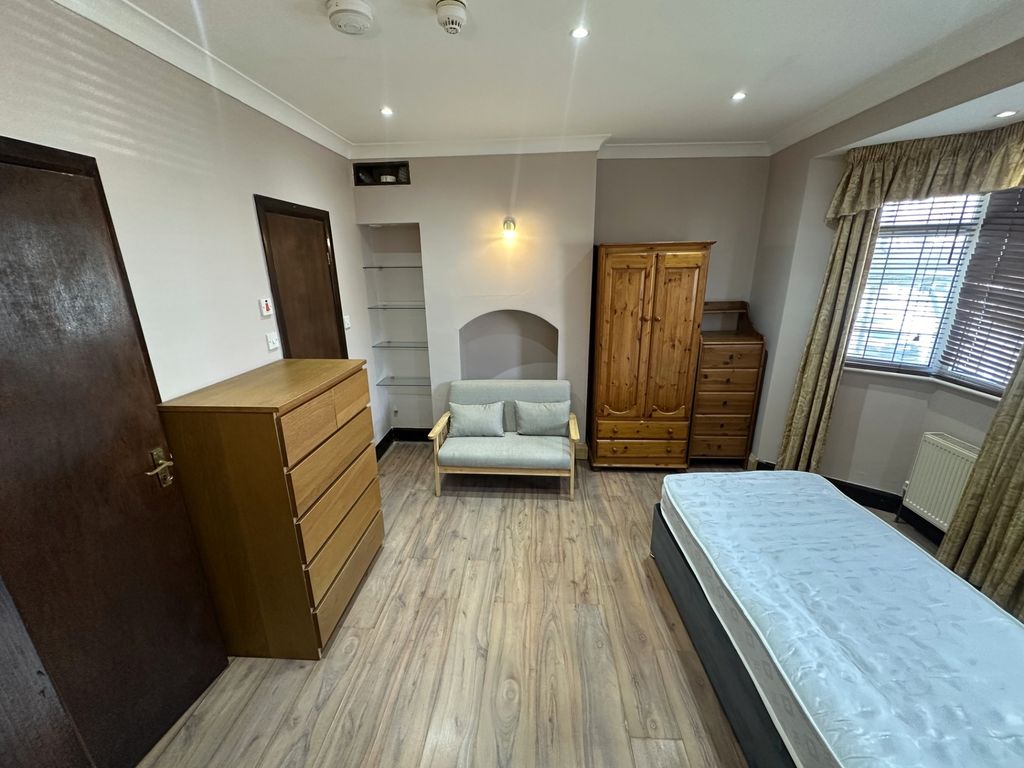 Property photo 3 of 8 Spacious Bedroom With Ample Storage And Seating...