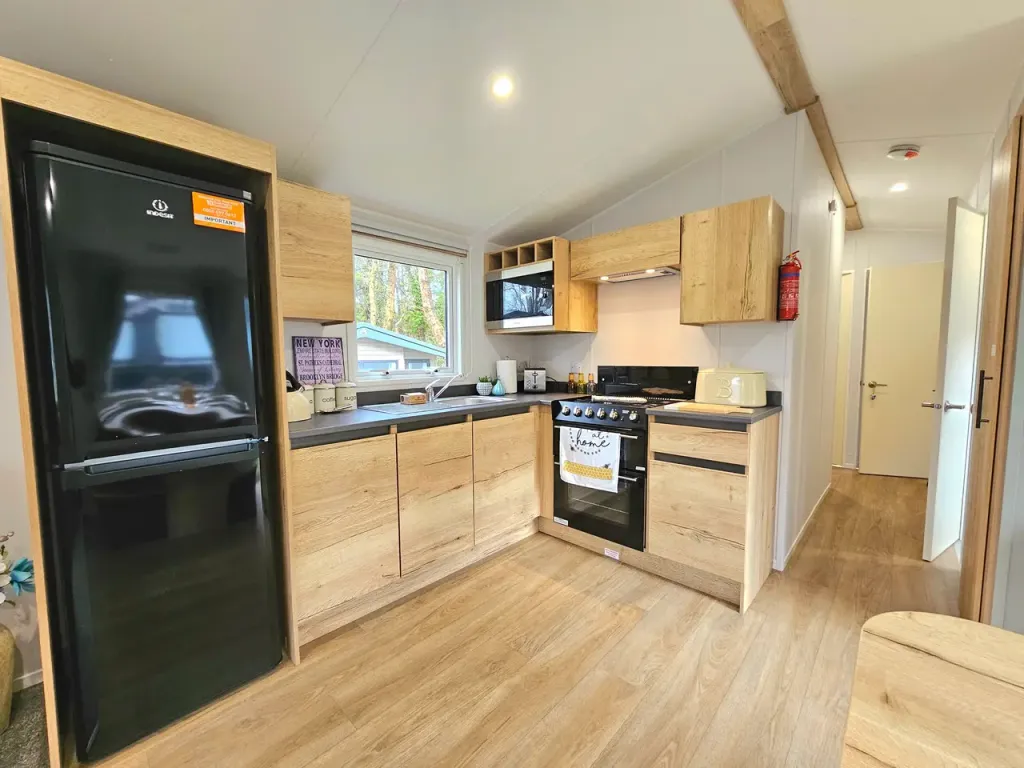 Property photo 3 of 17 Fully Integrated Kitchen With Fridge Freezer In The Willerby Midhurst Holiday Caravan At Brynteg Country & Leisure Retreat, Wales