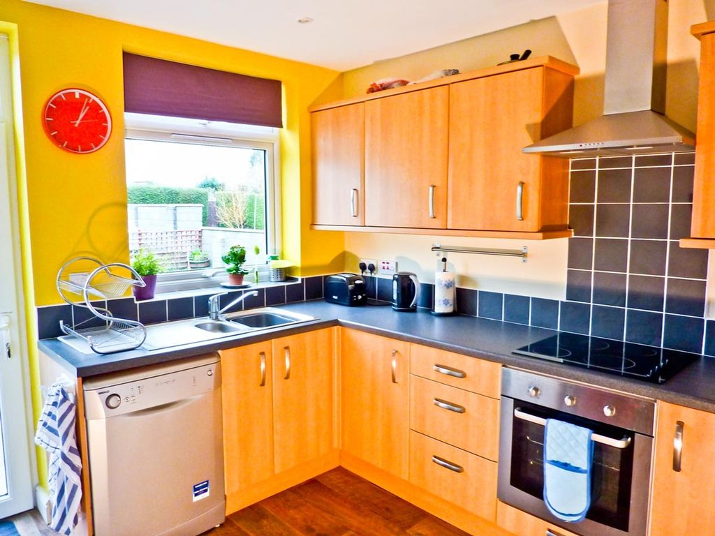 Property photo 2 of 5 A Bright And Modern Kitchen Featuring Ample Storag...