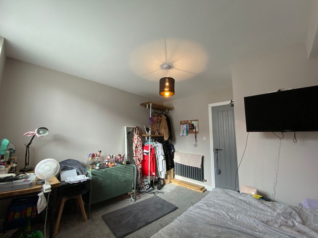 Property photo 3 of 6 A Cozy Living Room With Various Personal Items, A ...