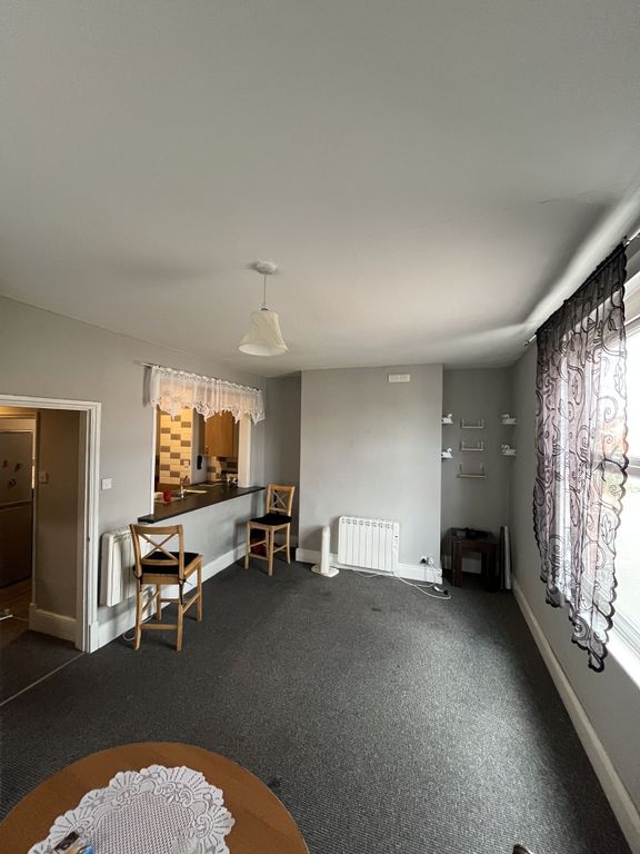 Property photo 1 of 5 A Cozy Living Room Featuring A Large Window With P...