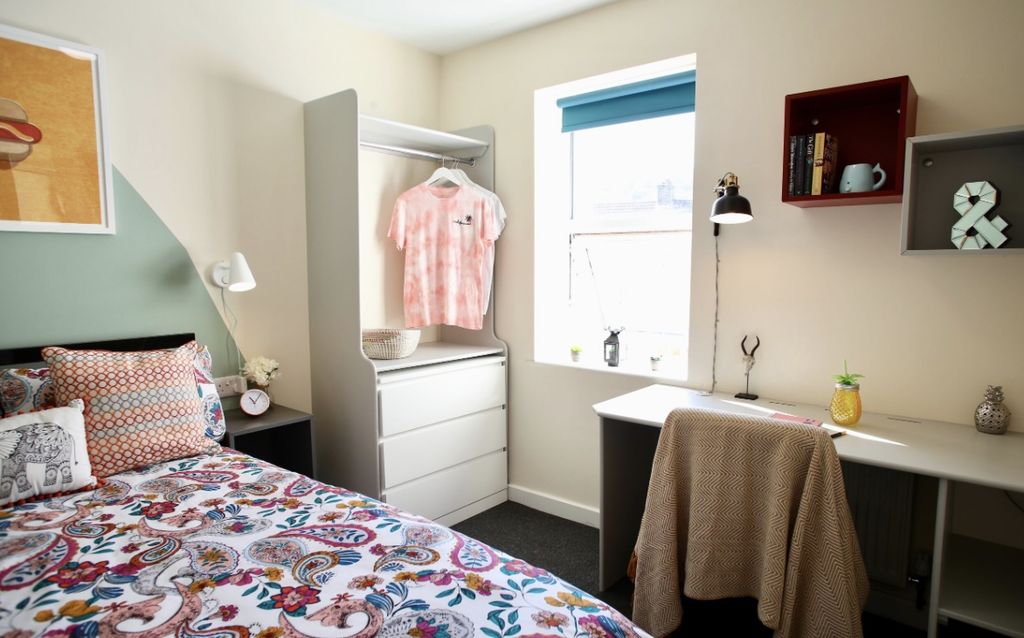 Property photo 3 of 4 This Cozy Double Bedroom Features A Vibrant Decor,...