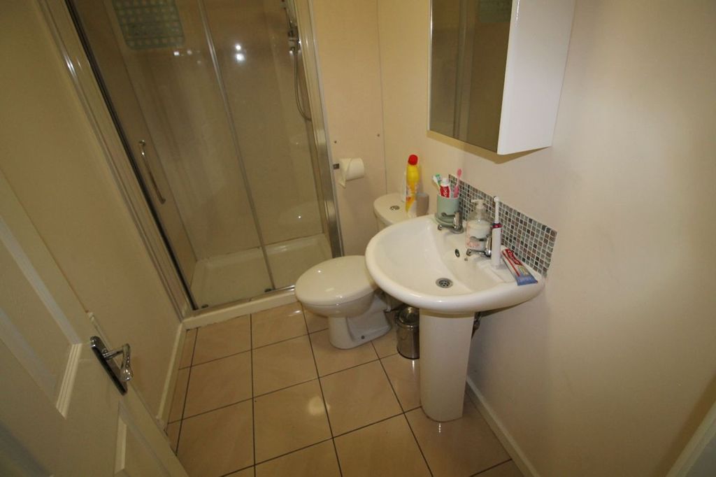 Property photo 1 of 8 This Well-Maintained Bathroom Features A Modern Sh...