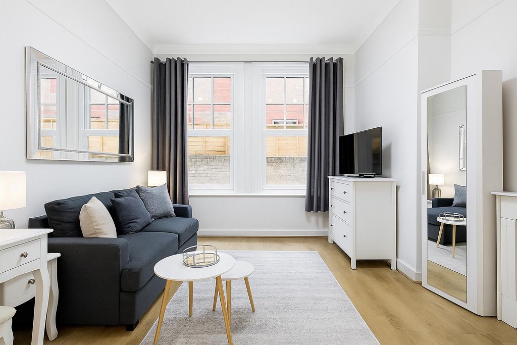 Property photo 1 of 5 Minimalist Living Room With Natural Light.Png