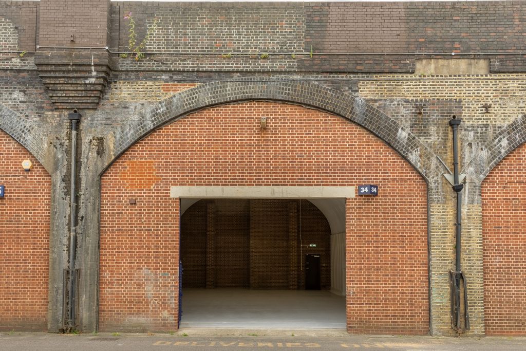 Property photo 1 of 5 The Front Of An Arch With An Open Electric Roller Shutter Entrance Big Enough For Vehicle Access.
