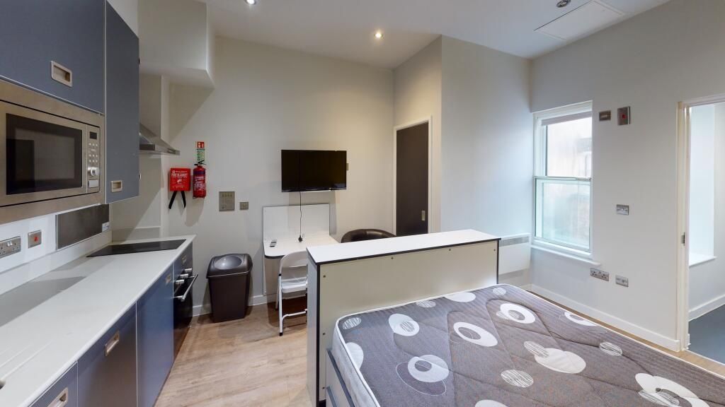 Property photo 2 of 3 A Bright And Modern Living Room With Ample Natural...