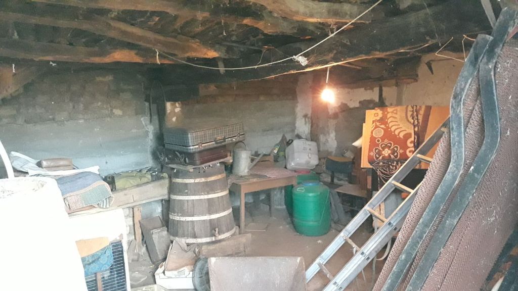 Property photo 3 of 46 Basement Area Of The House Featuring Exposed Beams And Stored Household Items