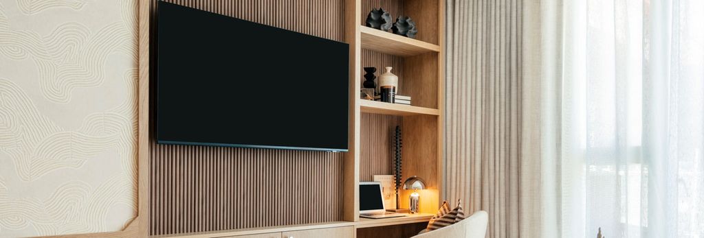 Property photo 3 of 5 An Image Of The TV On The Wall In The Living Area