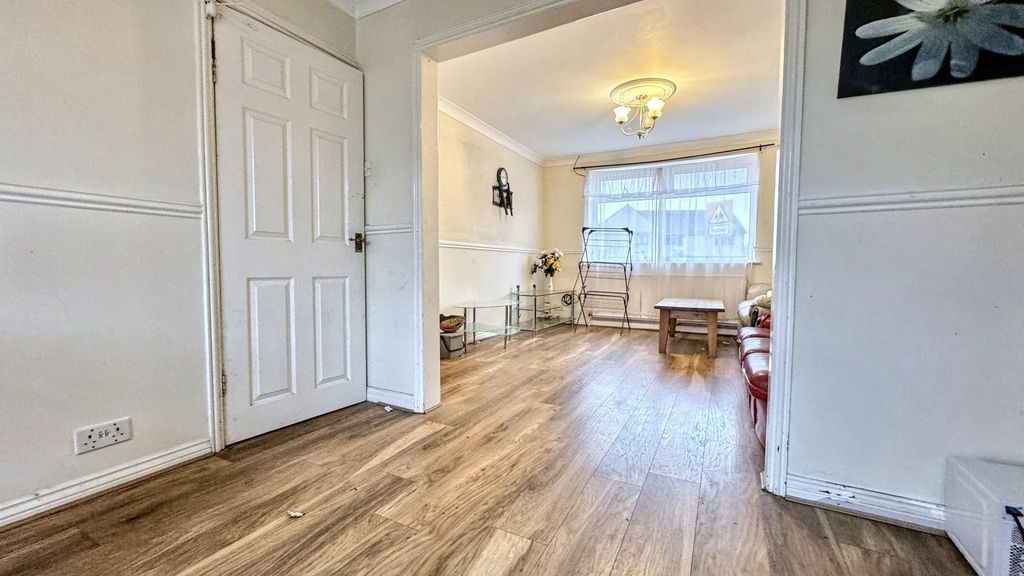 Property photo 1 of 12 Bright Living Room With Stylish Wood Floors...