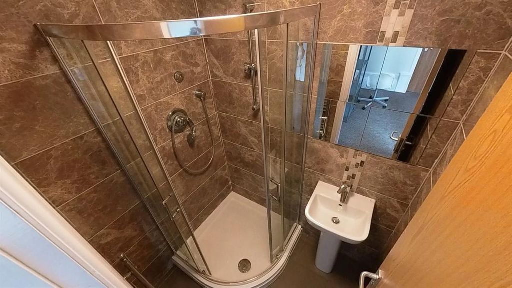 Property photo 2 of 15 Modern Tiled Bathroom With Stylish Glass Shower....