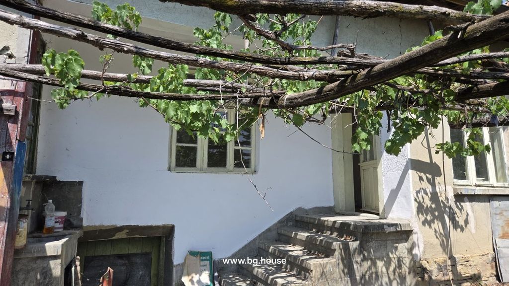 Property photo 1 of 29 Concrete Steps Lead To A Door On The House Exterior With A Grapevine Trellis Overhead.