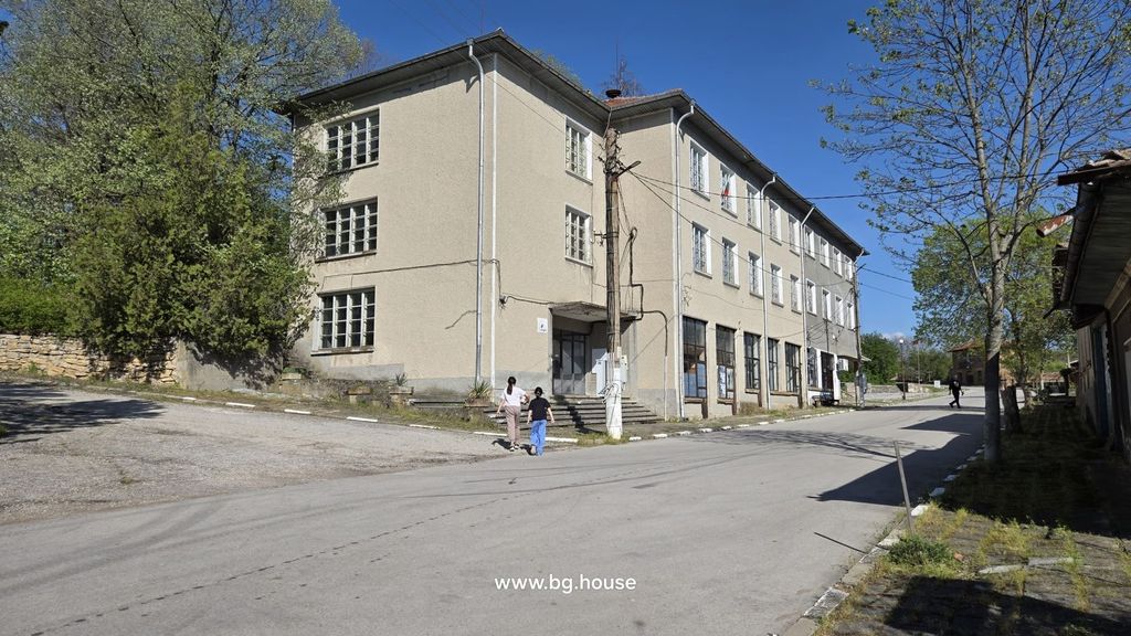 Property photo 2 of 28 Street Corner View Showing The Three-Storey Business Complex Surrounded By Trees And Pedestrians