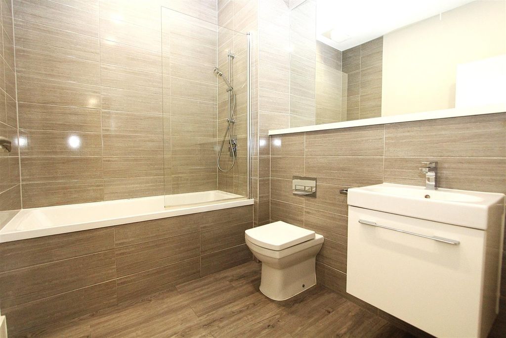 Property photo 2 of 8 Modern Bathroom With Sleek Tiles And Full Bath...