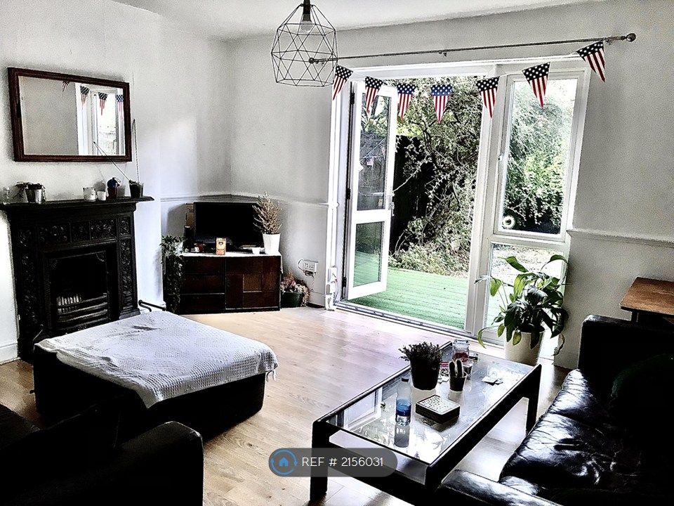 Property photo 2 of 11 Lounge Out Into The Garden Through The Patio Doors