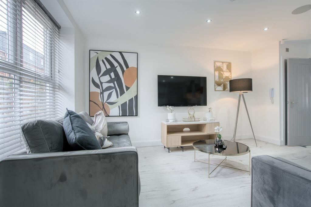 Property photo 1 of 15 Bright And Contemporary Living Room Featuring Comf...