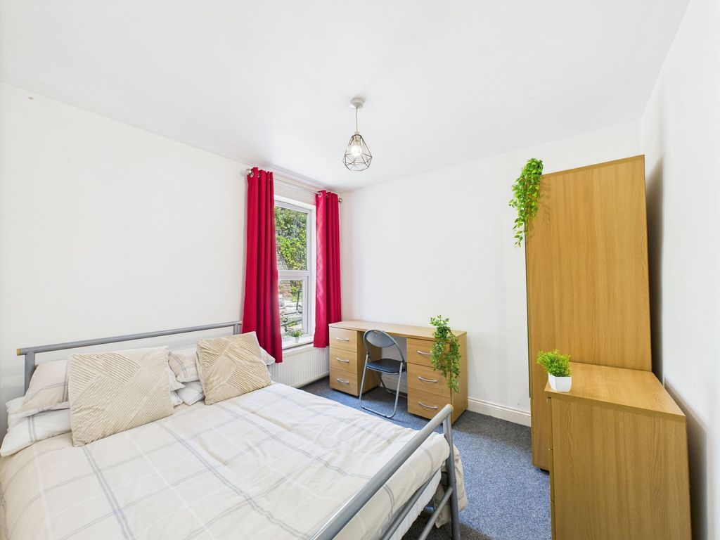 Property photo 3 of 6 Bright And Welcoming Master Bedroom Featuring A Do...