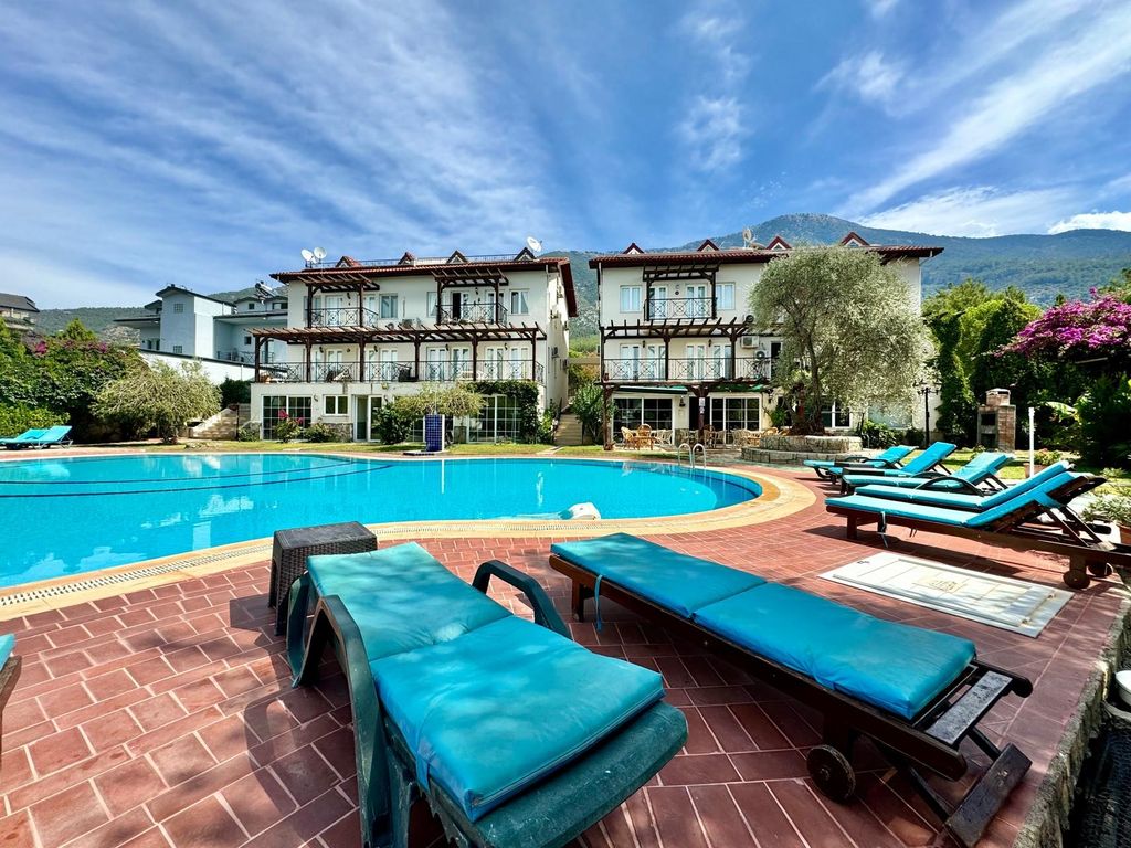 Property photo 2 of 21 Ready-To-Move Apartment For Sale In Ovacik, Fethiye – Sun Terraces Surrounding The Communal Pool