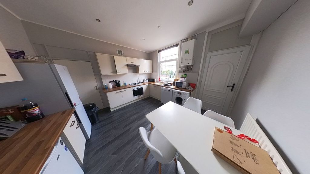 Property photo 2 of 15 Bright And Modern Kitchen Featuring Ample Workspac...