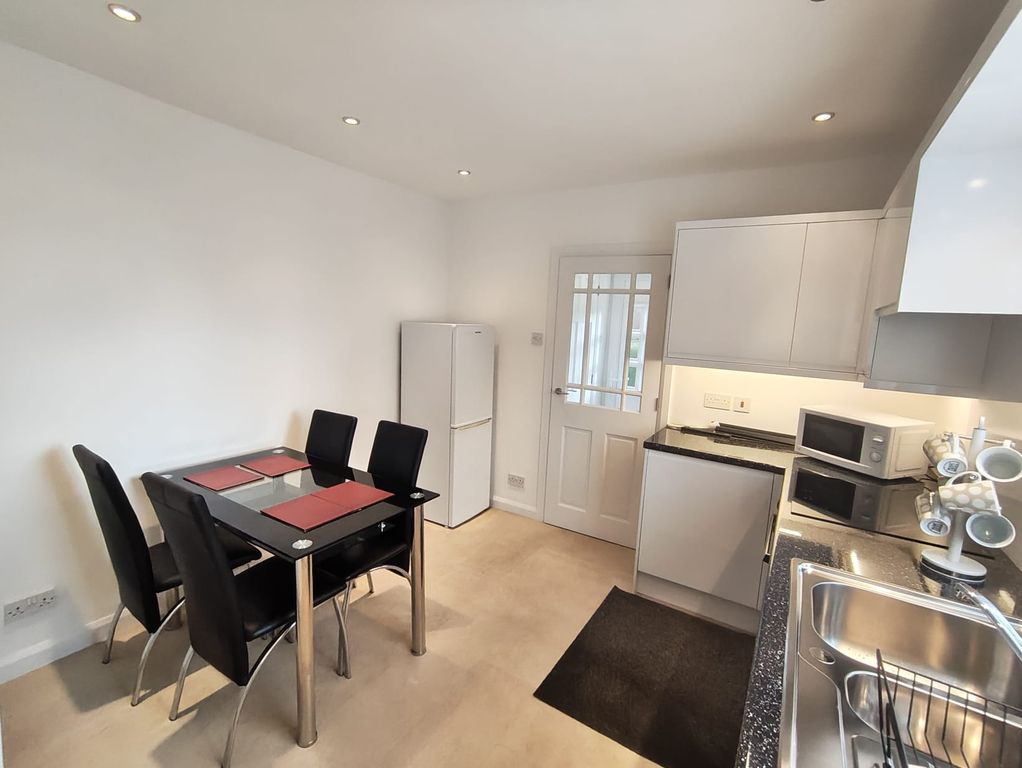 Property photo 3 of 18 Dining Kitchen
