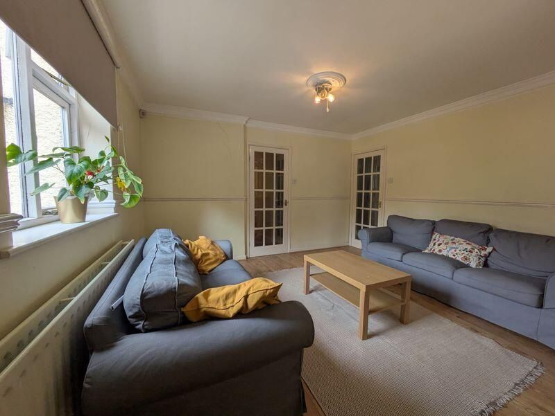 Property photo 3 of 14 A Cozy And Well-Maintained Living Room Featuring T...