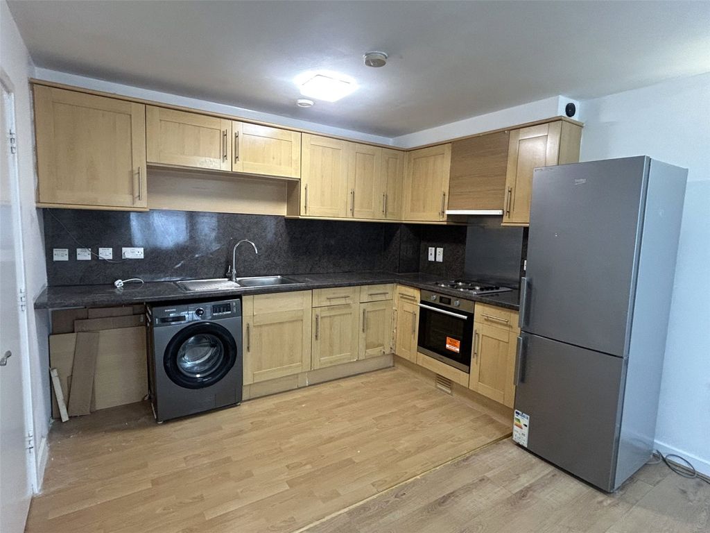 Property photo 3 of 8 Kitchen Area
