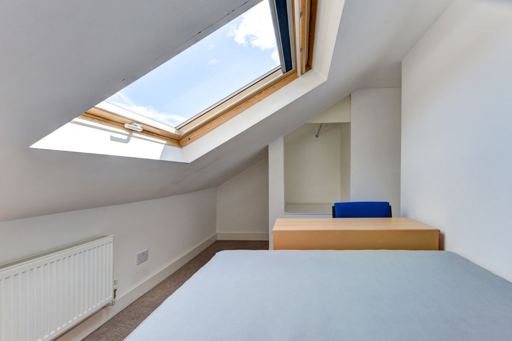 Property photo 3 of 20 A Bright And Tidy Bedroom Featuring A Skylight Win...