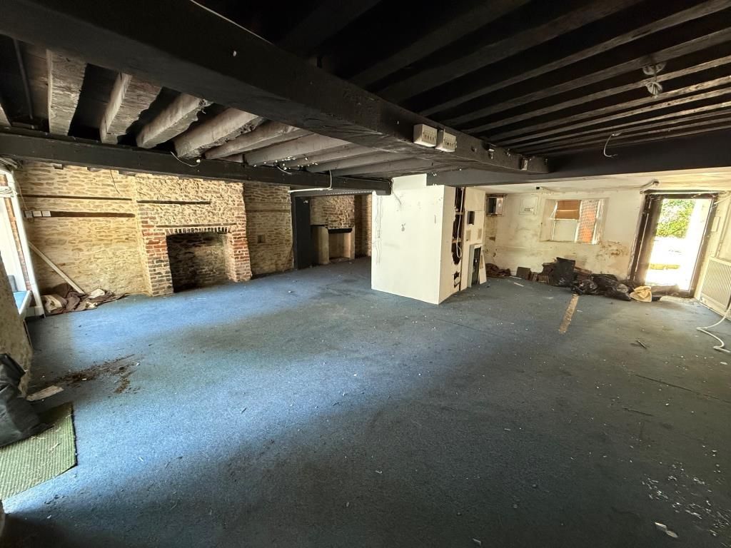 Property photo 2 of 6 Room With Exposed Brick And Wooden Ceiling Beams