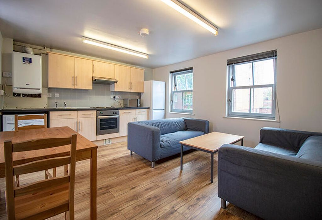 Property photo 1 of 3 Spacious And Modern Living Room Featuring Ample Na...