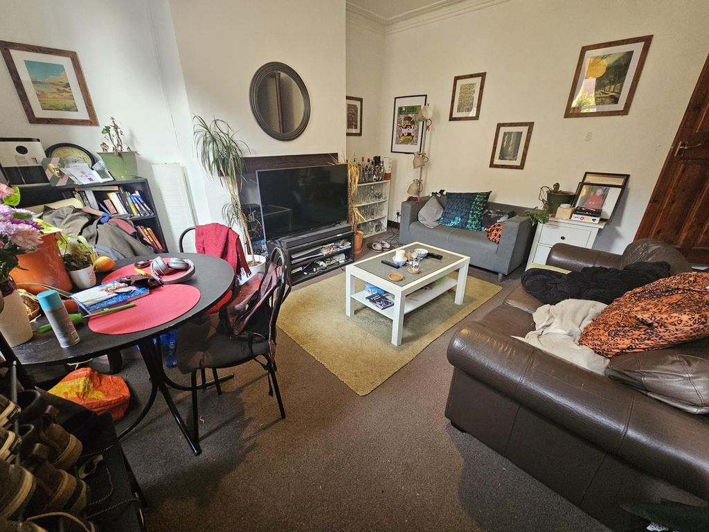 Property photo 1 of 7 Cozy Living Room Featuring Comfortable Sofas, A Co...