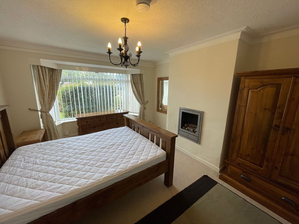 Property photo 2 of 9 A Well-Maintained Bedroom Featuring A Large Window...