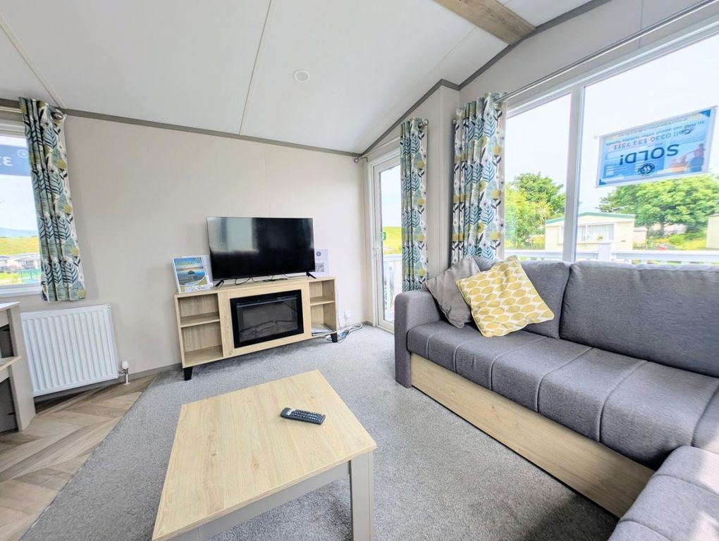 Property photo 3 of 10 Bright Lounge With L Shaped Seating, Electric Fire And Patio Doors