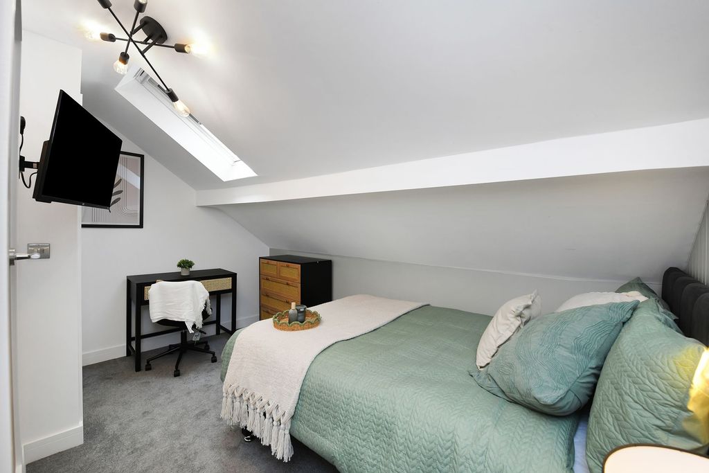 Property photo 3 of 7 Spacious Master Bedroom With Modern Decor, Natural...