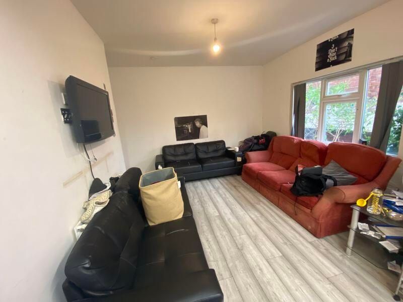 Property photo 2 of 10 A Bright And Welcoming Living Room Featuring Comfo...