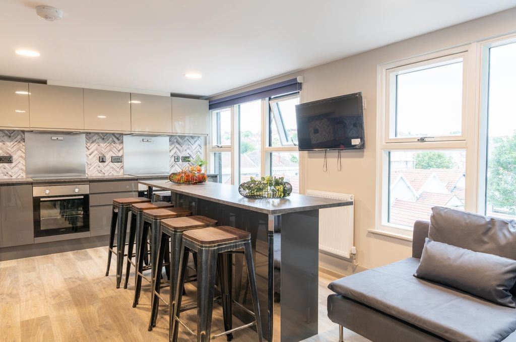 Property photo 1 of 16 A Modern And Inviting Kitchenette With Ample Natur...