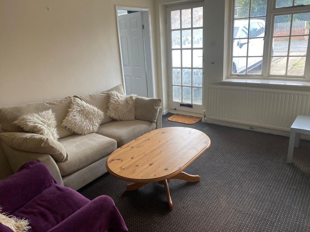 Property photo 3 of 12 A Cozy Living Room With Natural Light And Inviting...
