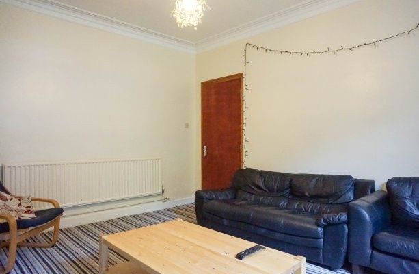 Property photo 2 of 15 A Cozy And Inviting Living Room With Comfortable S...