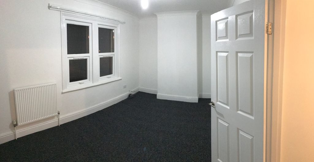 Property photo 3 of 6 A Spacious And Tidy Living Room With Ample Natural...