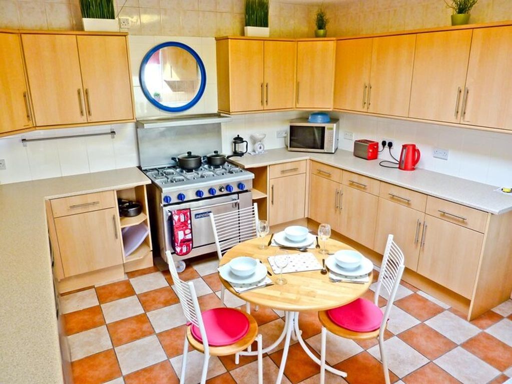 Property photo 3 of 6 A Bright And Tidy Kitchen Featuring Modern Applian...