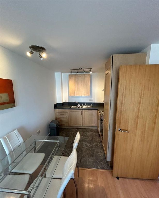 Property photo 3 of 7 Modern Kitchen With Dining Area And Wood Finish...