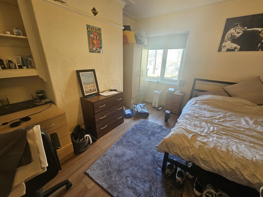 Property photo 2 of 14 A Spacious And Well-Lit Master Bedroom Featuring A...