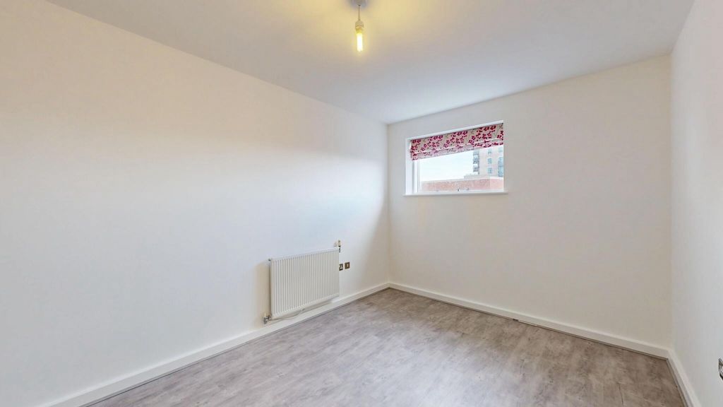Property photo 1 of 15 A Simple, Clean Room With Light Grey Flooring, Whi...