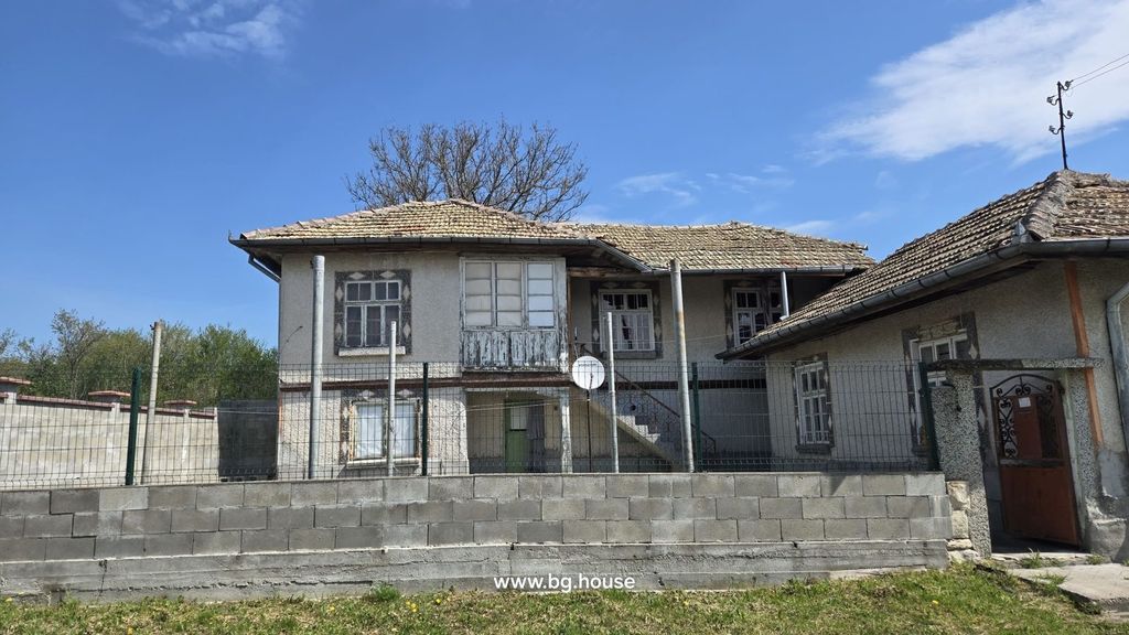 Property photo 1 of 41 Front View Of A Traditional Bulgarian House Showing Tiled Roof, Multiple Windows, And A Fenced Yard