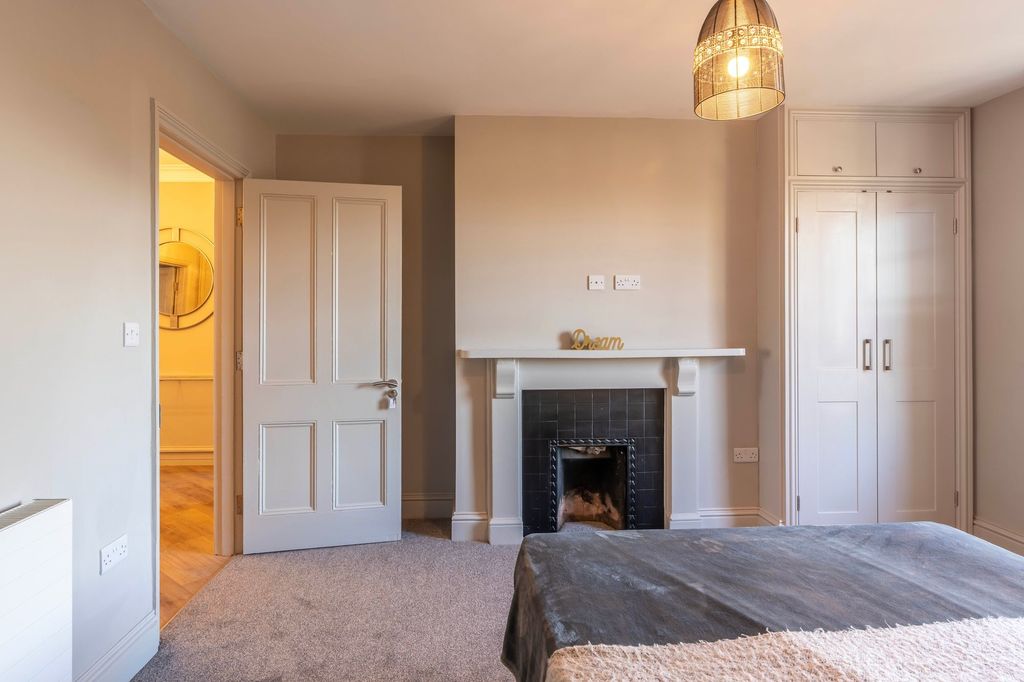 Property photo 2 of 9 Elegant Bedroom With Fireplace And Ample Storage...