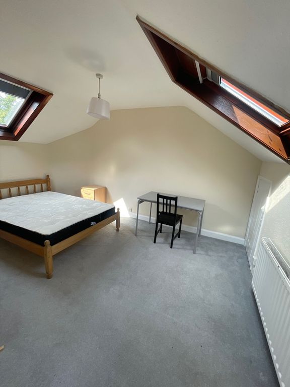Property photo 2 of 10 A Bright Double Bedroom Featuring Two Skylight Win...