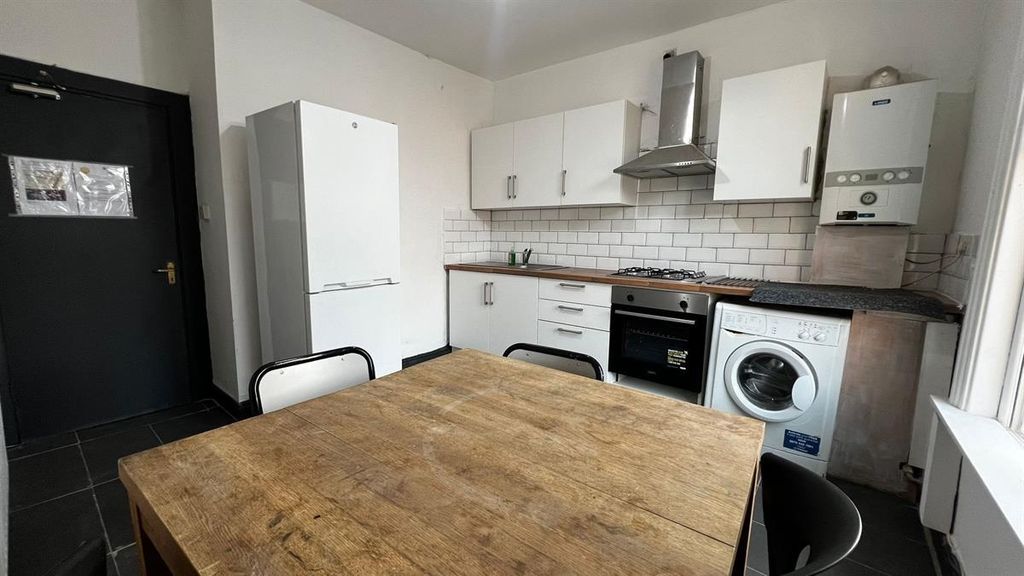 Property photo 2 of 9 Bright And Modern Kitchen Featuring Ample Storage,...