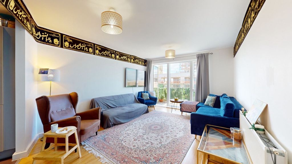 Property photo 2 of 8 A Bright And Inviting Living Room Featuring Comfor...